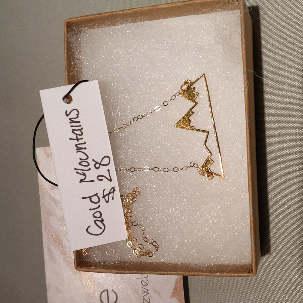 Gold mountain cutout necklace